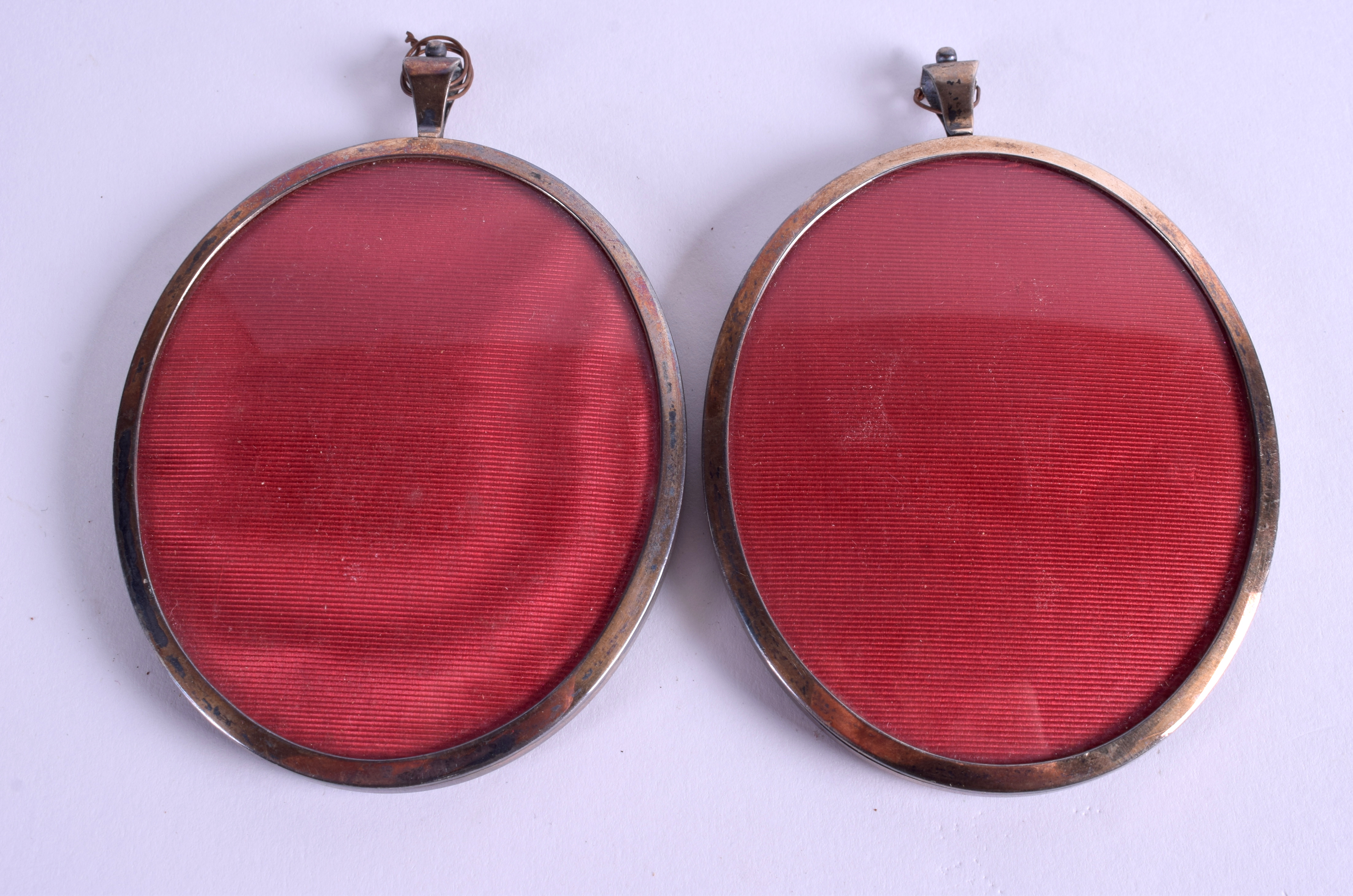 A PAIR OF LATE 19TH CENTURY PAINTED IVORY PORTRAIT MINIATURES within silver frames. 6.5 cm x 7.5 cm - Image 2 of 2