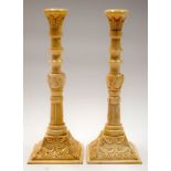 A PAIR OF BONE CANDLESTICK HOLDERS, carved with foliage. 23.5 cm high.