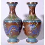 A PAIR OF EARLY 20TH CENTURY CHINESE CLOISONNE ENAMEL VASE, decorated with dragons in pursuit of th