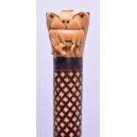 A RARE 19TH CENTURY ANGLO INDIAN IVORY INLAID WALKING CANE with ivory finial modelled as an animal