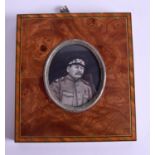 A 19TH CENTURY PAINTED IVORY MILITARY PORTRAIT MINIATURE within a walnut frame. 5 cm x 6 cm.