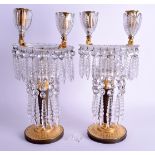 A FINE PAIR OF EARLY 19TH CENTURY ORMOLU AND BRONZE CANDLESTICKS with wonderful graduated prism cut