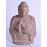 A 19TH CENTURY INDIAN CARVED STONE BUST OF A BUDDHIST DEITY modelled with hands clasped. 24 cm x 13