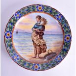 A GERMAN HEISTERKAMP ROYAL BONN POTTERY CHARGER painted with a mother and child on the shore. 33 cm