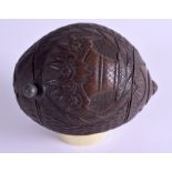 AN EARLY 19TH CENTURY CARVED COCONUT BUGBEAR POWDER FLASK decorated with baskets and foliage. 11 cm