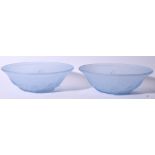 A PAIR OF FROSTED GLASS BOWLS, decorated in relief with foliage. 21 cm wide.