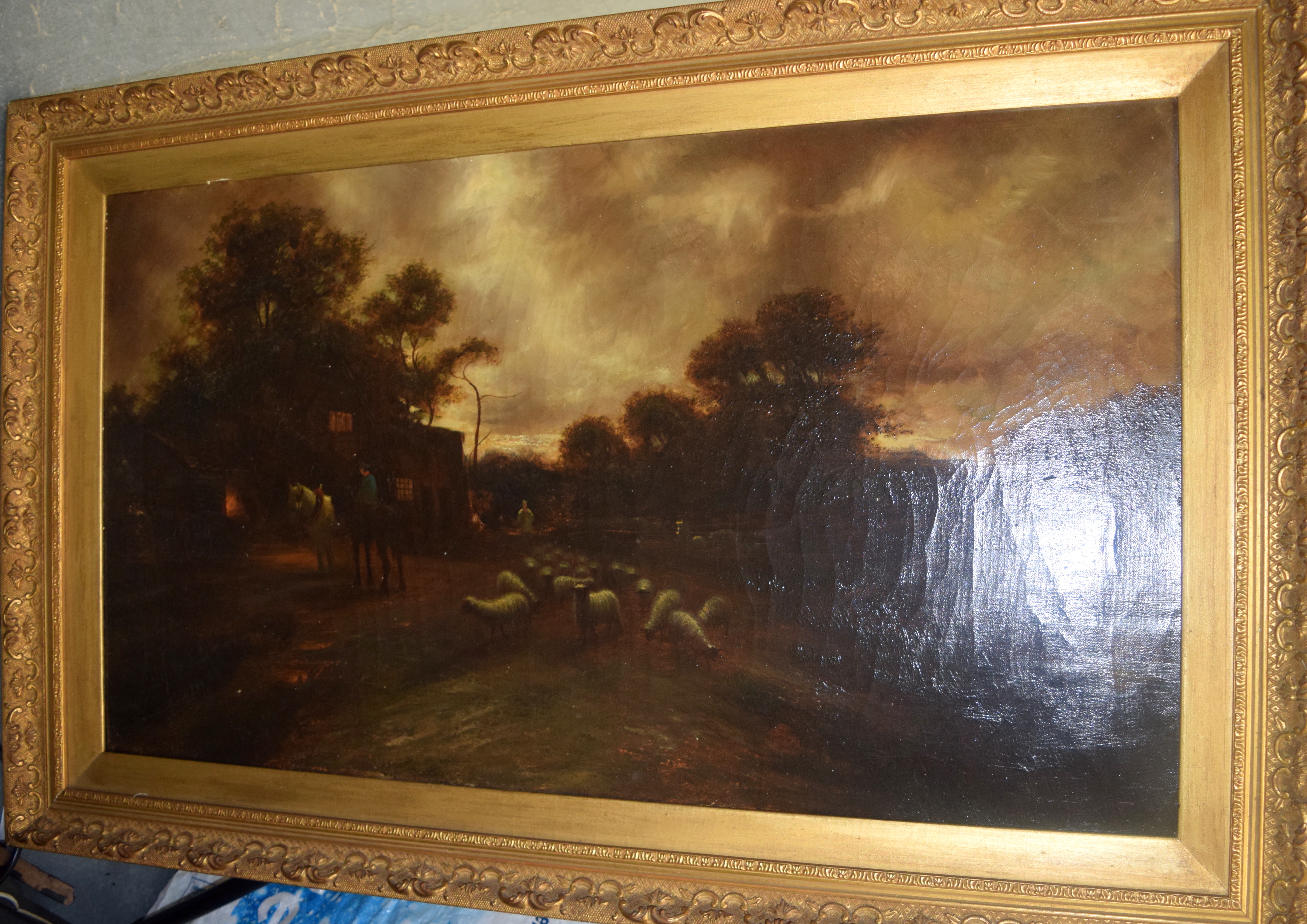 BRITISH SCHOOL (Early 20th century) FRAMED OIL ON CANVAS, a male with sheep in a landscape. 44 cm x