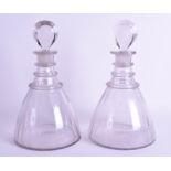 A PAIR OF REGENCY GLASS DECANTERS AND STOPPERS. 28 cm high.