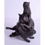 A GOOD 19TH CENTURY JAPANESE MEIJI PERIOD BRONZE OKIMONO modelled as three grappling cats with gold