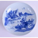 A 19TH CENTURY CHINESE BLUE AND WHITE DISH Qing, painted with fisherman in a landscape. 27 cm diame