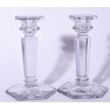 A PAIR OF 20TH CENTURY GLASS CANDLESTICKS, formed upon octagonal bases. 18 cm high.