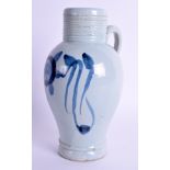 AN 18TH CENTURY DELFT FAIENCE TIN GLAZED FLAGON painted with a stylised flower. 18 cm high.