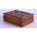 A 19TH CENTURY CONTINENTAL CARVED BOXWOOD SNUFF BOX decorated with scrolling foliage. 7 cm x 5.25 c