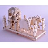 A LARGE 19TH CENTURY INDIAN CARVED IVORY FIGURE OF A CARRIAGE modelled with numerous attendants and