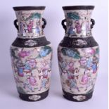 A PAIR OF 19TH CENTURY CHINESE FAMILLE ROSE CRACKLE GLAZED VASES painted with warriors. 36 cm high.