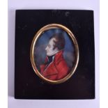 AN EARLY 19TH CENTURY PAINTED IVORY PORTRAIT MINIATURE depicting a male wearing a red coat. 6 cm x