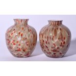 A PAIR OF ITALIAN SPECKLED GLASS VASE, formed with flared lip and mottled decoration. 10 cm high.