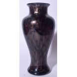 A BLACK MOTTLED GLASS BALUSTER VASE, formed wit speckled decoration to body. 29 cm high.