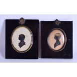 A PAIR OF 19TH CENTURY PORTRAIT SILHOUETTES depicting females. 6.5 cm x 8.25 cm.