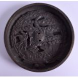 AN 18TH CENTURY JAPANESE EDO PERIOD BRONZE MIRROR decorated canes amongst pine trees. 12 cm diamete