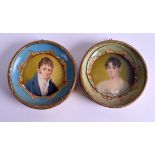 A PAIR OF EARLY 20TH CENTURY CONTINENTAL PAINTED IVORY PORTRAIT MINIATURES within painted frames. 5