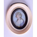 A MID 19TH CENTURY PAINTED IVORY PORTRAIT MINIATURE depicting a curly haired female. 4.5 cm x 5.5 c