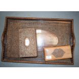 A LARGE INDIAN TWIN HANDLED HARDWOOD TRAY together with two boxes. Largest 50 cm x 35 cm. (3)