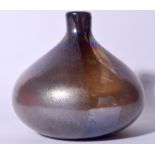 A LARGE ONION SHAPED TIFFANY TYPE IRIDESCENT GLASS VASE, formed with a bulbous body and mottled dec