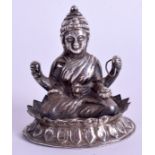 AN EARLY 20TH CENTURY CAMBODIAN INDIAN SILVER FIGURE OF A BUDDHA modelled upon a lotus flower. 56 g