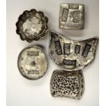 A GROUP OF FIVE CHINESE WHITE METAL INGOTS, varying shape. Largest 7.8 cm wide. (5)