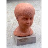 ANN MCGLADDERY (20th Century) A terracotta bust. 32 cm x 16 cm.