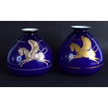 AN UNUSUAL PAIR OF CONTINENTAL BLUE OPALINE GLASS VASES painted with unicorns. 20 cm x 15 cm.