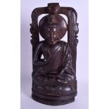 AN EARLY 20TH CENTURY INDIAN CARVED WOOD FIGURE OF A BUDDHA modelled with one hand raised. 31 cmx 1