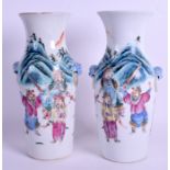 A PAIR OF 19TH CENTURY CHINESE FAMILLE ROSE VASES Qing, painted with figures on horseback. 23.5 cm