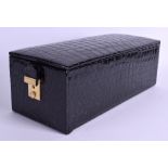 A CROCODILE SKIN JEWELLERY BOX. 31 cm x 11 cm.