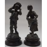 A PAIR OF EARLY 20TH CENTURY SPELTER FIGURINES, in the form of a young male and female, standing up