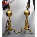A STYLISH PAIR OF ANTIQUE BRASS FIRE DOGS, formed with spherical top and hexagonal stem. 56 cm high