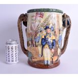 A LARGE ROYAL DOULTON TWIN HANDLED LIMITED EDITION NELSON CUP no 28 of 600. 27 cm x 23 cm.