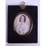 AN EARLY 19TH CENTURY PAINTED IVORY PORTRAIT MINIATURE modelled as a female wearing white robes. 6