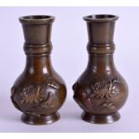 A PAIR OF 19TH CENTURY JAPANESE MEIJI PERIOD BRONZE VASES onlaid with foliage. 8.5 cm high.