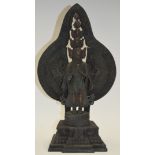 A LARGE INDIAN BRONZE BUDDHA, modelled standing upon a stepped base. 39 cm high.