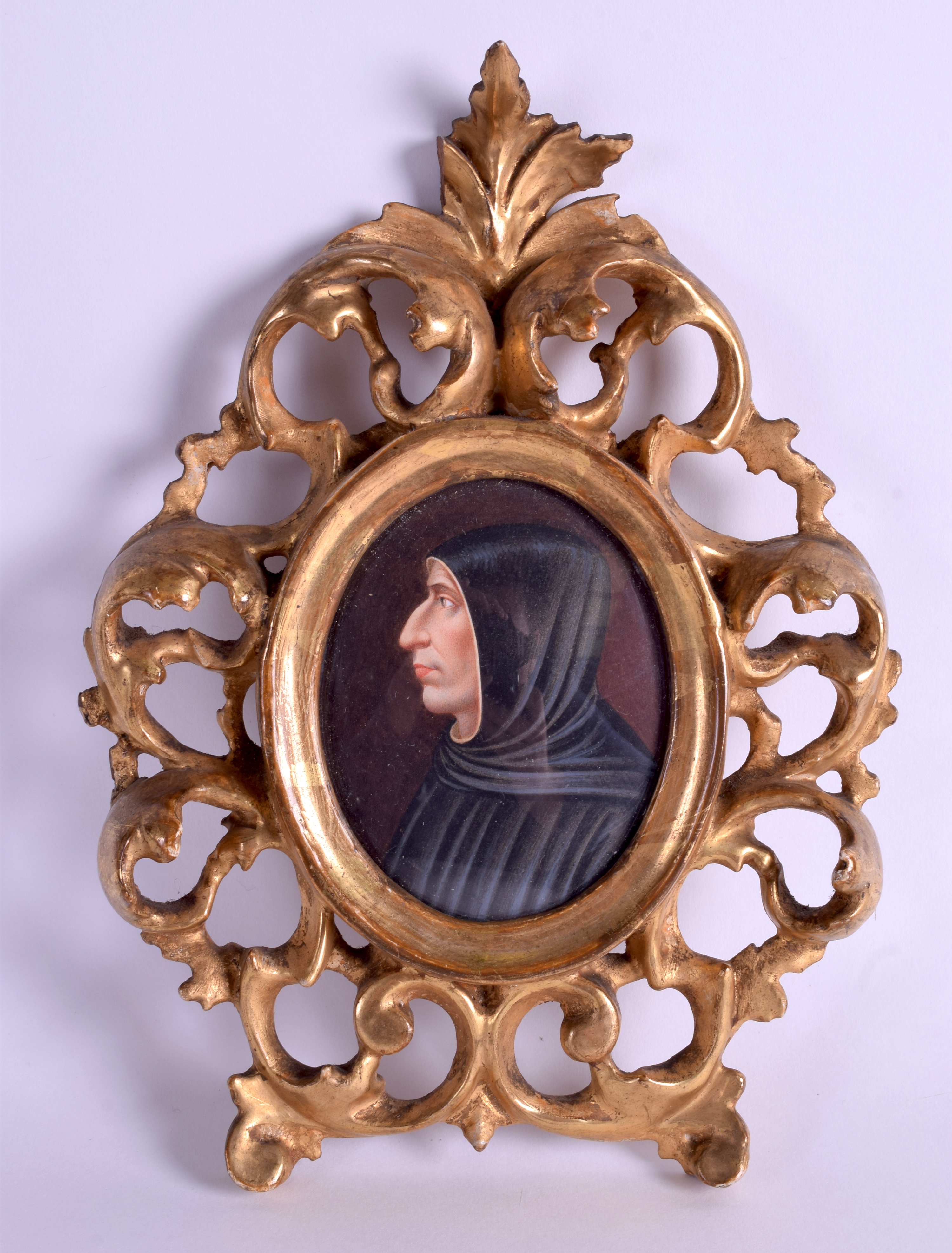 AN EARLY 19TH CENTURY ITALIAN PAINTED PORTRAIT MINIATURE depicting a male wearing a black cloak. 6.