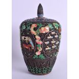 A RARE EARLY 20TH CENTURY CHINESE SILVER AND ENAMEL VASE AND COVER decorated in relief with foliage