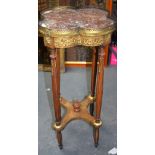 AN EARLY 20TH CENTURY MARBLE TOP ORMOLU MOUNTED TABLE, decorated with foliage. 74 cm high.