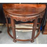 A RARE 19TH CENTURY CHINESE CARVED HARDWOOD DEMI LUNE CONSOLE TABLE possibly Huanghuali, with lingz