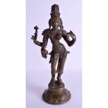A 19TH CENTURY INDIAN BRONZE FIGURE OF A BUDDHIST DEITY modelled upon a lotus base. 31 cm high.