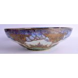 AN UNUSUAL ROYAL WORCESTER FAIRYLAND LUSTRE TYPE BOWL painted with buildings and landscapes. 32 cm