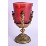 A LOVELY EARLY 19TH CENTURY BOHEMIAN RUBY GLASS GOBLET encased within a bronze mount. 17 cm x 9 cm.