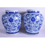 A FINE LARGE PAIR OF 17TH/18TH CENTURY CHINESE BLUE AND WHITE VASES Yongzheng/Qianlong, painted wit