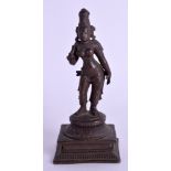 A 19TH CENTURY INDIAN BRONZE FIGURE OF A DEITY. 11 cm high.